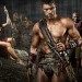 Katrina Law as Mira, Liam McIntyre as Spartacus, Peter Mensah as Oenomaus, & Manu Bennett as Crixus