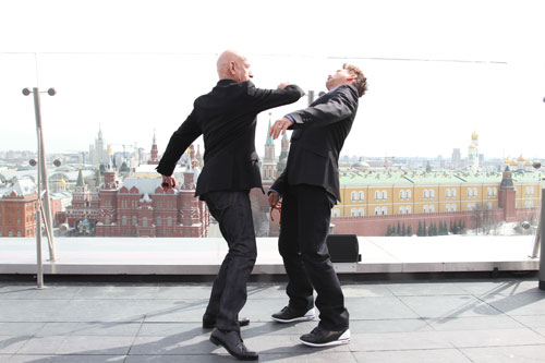 Ben Kingsley aims a punch at Robert Downey Jr