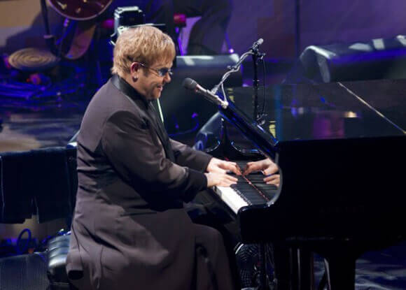 Elton John at piano photo